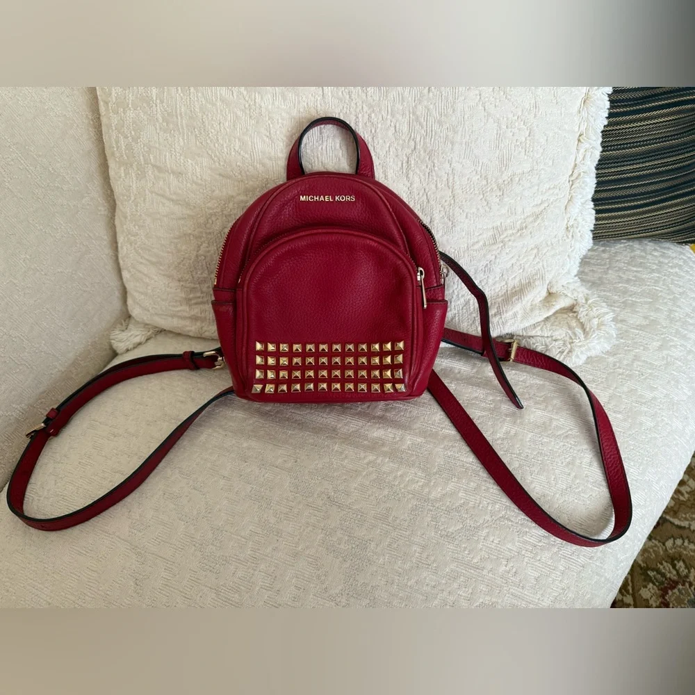 Michael Kors Abbey XS Studded Red Backpack with Gold Studs
Size 7 by 8 by 3 - Picture 16 of 16